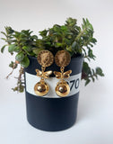 Butterfly and Orb earrings.
